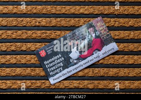 Post mail on doormat - Christmas appeal from the Salvation Army Stock Photo