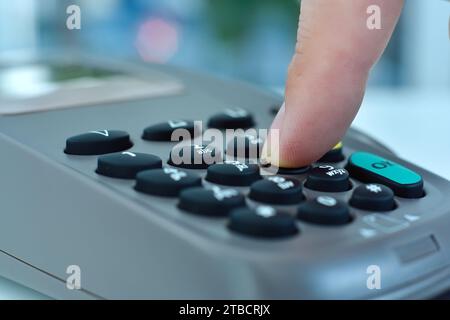 Pin Code Pos Hand dials pin code on pos terminal with blue credit card. Payment with ...