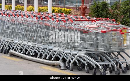 Supermarket shopping carts lined up empty Stock Photo
