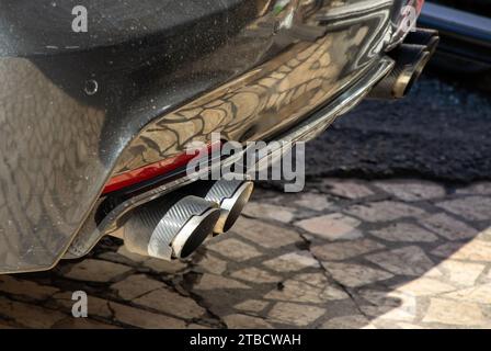 Sports car double exhaust black color close-up view Stock Photo