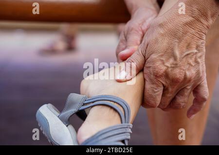 a woman touching at pain point. Joint pain, Arthritis and tendon problems. Stock Photo