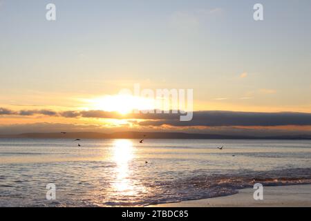December Sunset at Southbourne Beach in Bournemouth Dorset Stock Photo