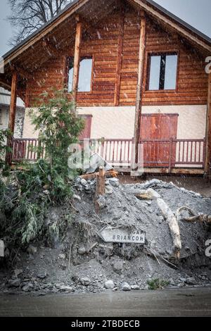 Guillestre, France. 04th Dec, 2023. A house submerged in mud with a road sign pointing to Gap and Briancon, in the Hautes-Alpes region of France, the equivalent of two months rainfall fell in 48 hours. The floods caused widespread damage, including in the village of Guillestre and the ski resort of Risoul, France, on December 04, 2023. Photo by Thibaut Durand /ABACAPRESS.COM Credit: Abaca Press/Alamy Live News Stock Photo