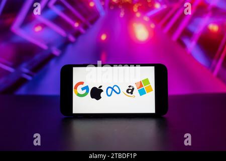 In this photo illustration, the big tech companies Google, Apple, Meta, Amazon, Microsoft logos seen displayed on a mobile phone screen. Stock Photo