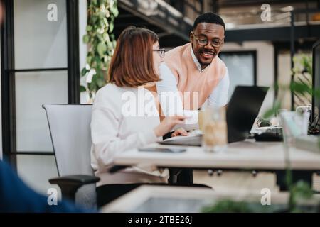 A group of professionals collaborating in a corporate office, driving business growth and solving problems with teamwork and technology. Stock Photo
