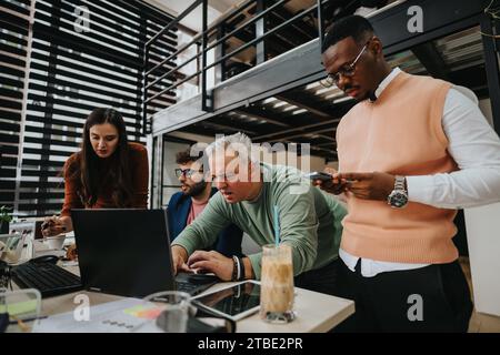 Diverse business team brainstorming and collaborating in corporate office. Analyzing growth, market research, and revenue. Stock Photo