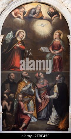 VICENZA, ITALY - NOVEMBER 5, 2023: The  painting of Anuntiation with the sanits in Chiesa di Santa Maria dei Servi by unknown artist. Stock Photo
