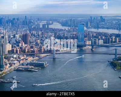 Brooklyn Bridge of the East River opened in 1883 and spans 1600 feet. In 1964, the bridge was declared a historic landmark. Stock Photo