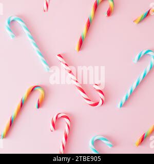 Creative minimal Christmas art. Pattern made with Christmas candies on pastel pink background. Flat lay. Copy space. Minimal composition. Stock Photo