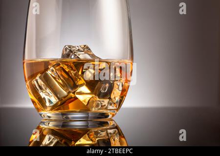 Glass of whisky with ice cubes Stock Photo