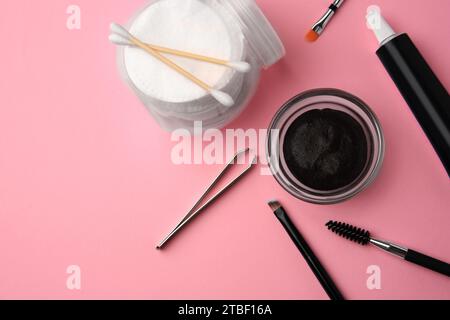 Flat lay composition with eyebrow henna and tools on pink background. Space for text Stock Photo