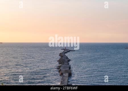 lighthouse on the end of walkway at Cijin island,  Kaohsiung, Taiwan Stock Photo