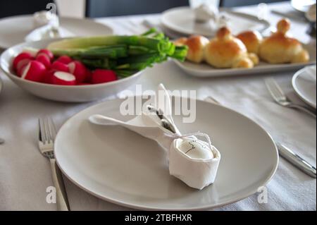 Decorated table served for Easter dinner Stock Photo
