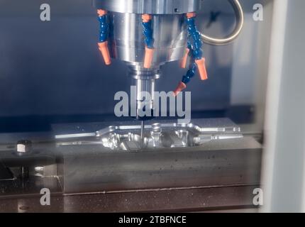 High precision CNC machining center machine cutting workpiece. Industrial metalworking manufacturing Stock Photo