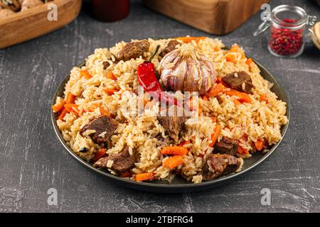 Large dish with Uzbek festive pilaf plov Stock Photo