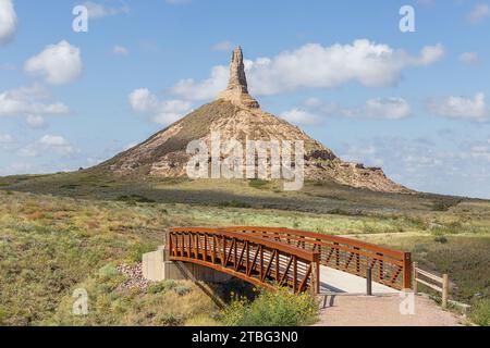 The bridge leading to Chimney Rock, a geological rock formation in the North Platte River valley Stock Photo