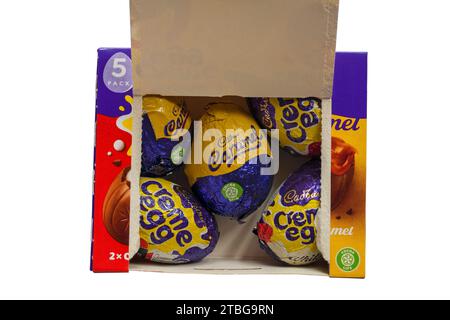 Box of Cadbury creme egg mixed classic white & caramel creme eggs 5 pack Cadburys opened to show contents set on white background Stock Photo