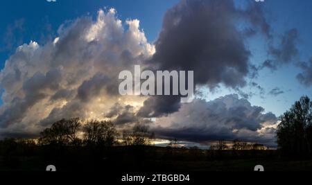 Panoramic landscape of cloudy sky with thickening low clouds Stock Photo