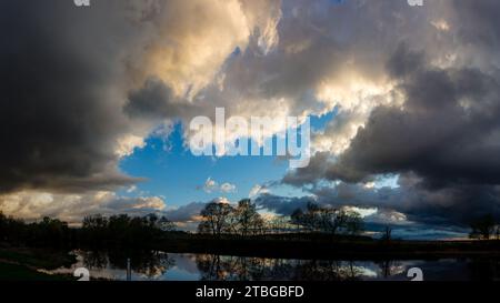 Panoramic landscape of cloudy sky with thickening low clouds Stock Photo