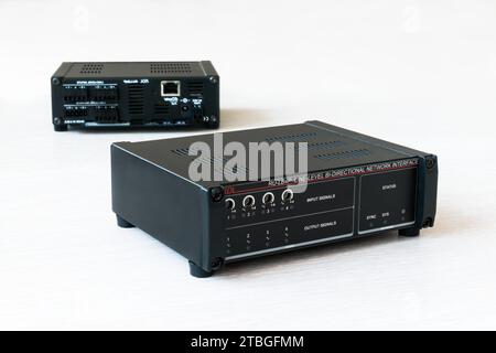 RDL RU-LB4P Line-Level Bi-Directional Network Dante Audio Interface on a white background and the reflection of the back panel in the mirror Stock Photo