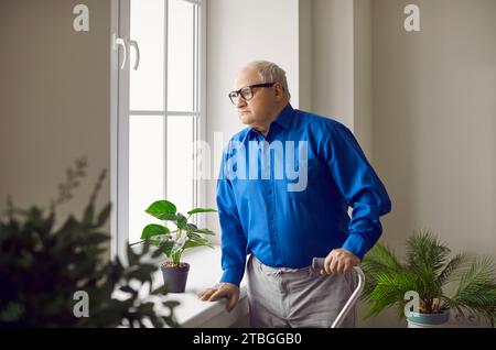 Portrait of pensive senior man looking at window Stock Photo