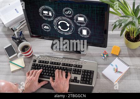 Man using a computer with system update concept on the screen Stock Photo