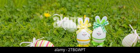 Easter object. colored hand painted easter eggs and decorative rabbits are symbols of the holiday. composition on a light background Stock Photo