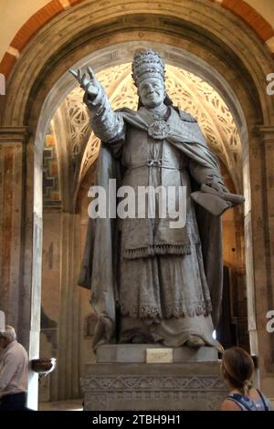 Milano Italy - Basilica Sant'Ambrogio, inside, statue of Pontiff Pio IX Stock Photo