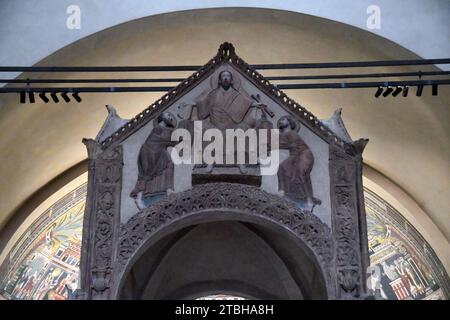 Milano Italy - Basilica Sant'Ambrogio, inside, ciborium depicts Christ delivering the law to Saint Peter and Saint Paul Stock Photo