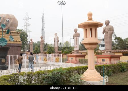 Statues of disciples of Lord Buddha sorrounds the the Great Buddha Statue in Bodh Gaya,Bihar Stock Photo