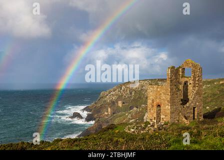 Rainbow over ruined tin mine engine houses near Botallack, Cornwall, England.  Autumn (November) 2023. Stock Photo