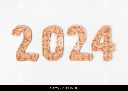 Demonstrating The Colors Of 2024 Peach Fuzz Knitted Peach Background   Demonstrating The Colors Of 2024 Peach Fuzz Knitted Numbers 2024 Peach Colors 2tbhnhg 