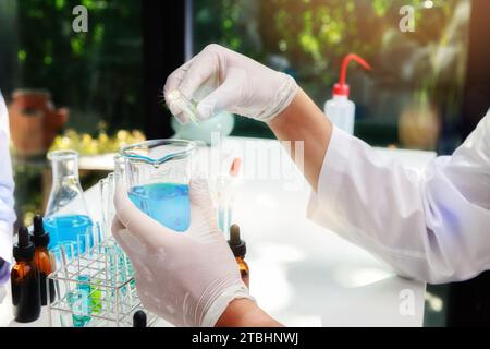 Team of researcher or scientists working in laboratory. Researcher or scientists working in laboratory. Researchers are inventing vaccines to treat CO Stock Photo