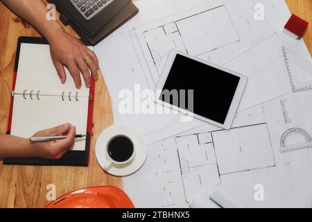 Top view of architect working with new startup project at home office. Work from home. Stock Photo