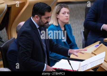 Edinburgh, Scotland, UK. 7th Dec, 2023. PICTURED: (L) Neil Grey MSP, Scottish Cabinet Secretary for Wellbeing Economy, Fair Work and Energy, (C) Humza Yousaf MSP, First Minister of Scotland and Leader of the Scottish National Party, (R) Shona Robison MSP, Scottish Depute First Minister. Weekly session of First Ministers Questions in Holyrood at The Scottish Parliament. Credit: Colin D Fisher Credit: Colin Fisher/Alamy Live News Stock Photo