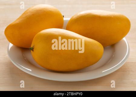 Plate with fresh sweet yellow  Nam Dok Mai mango close up Stock Photo