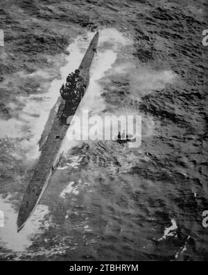 The capture of a German U-Boat in the Atlantic Ocean by a Hudson Reconnaisance and light bomber aircraft of Coastal Command during the Second World War. Following the capture on the 8th September 1941, the aircraft stood guard until naval reinforcements arrived when a Royal Navy officer approached the submarine to receive its surrender. Stock Photo