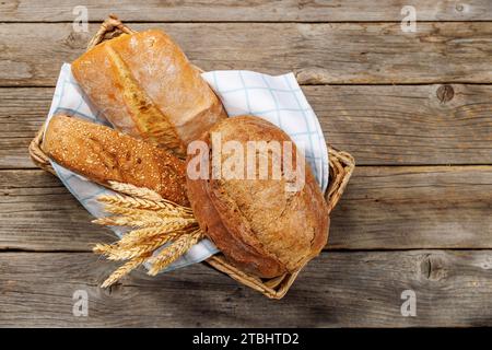 Assorted bread varieties in a charming basket, ready to be enjoyed. Flat lay Stock Photo