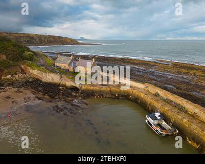 Aerial view of Cove harbour and coastline in Scottish Borders, Scotland , UK Stock Photo