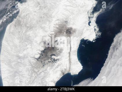 Satellite image of Shiveluch Volcano ash plume drifting over the Kamchatka Peninsula. Stock Photo