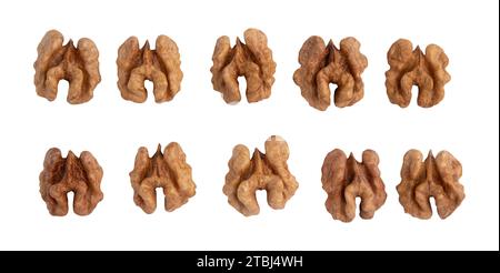 halves of walnuts isolated on white background, pattern top view, snack food concept, vegan meal Stock Photo