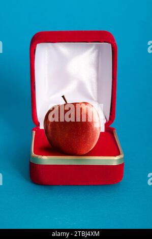 gift box with a red apple inside it Stock Photo