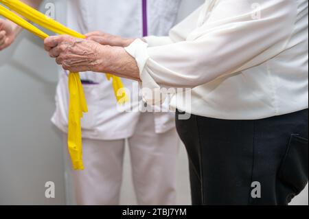 Seniors patients doing exercises in a retirement home. High quality photography. Stock Photo