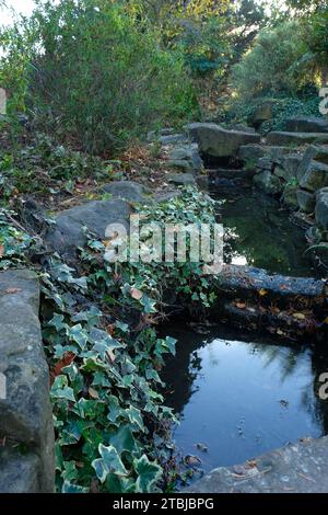 A Landscape of a water canal in a garden Stock Photo