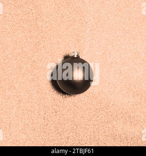 Peach fuzz, color of the year 2024. Christmas decoration, on shiny glitter background. Stock Photo