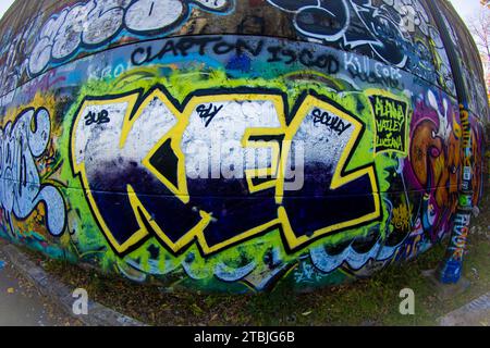An aerial view of a peculiar spherical object covered in graffiti artwork Stock Photo