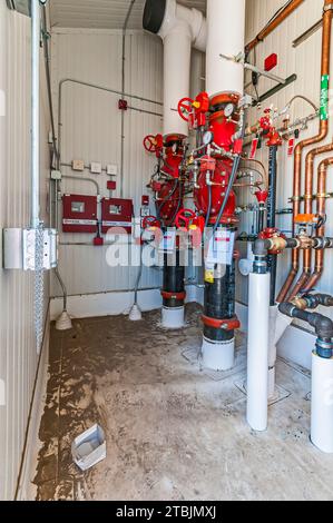 A small fire-suppression control room on the roof of a CO2 cold-storage (industrial refrigeration) warehouse. Stock Photo