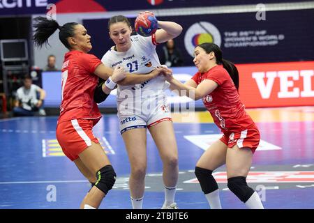 Icelands Diana Manusdottir between Greenlands Lykke Hansen, left, and Anja Heilmann during the IHF Presidents Cup handball match between Greenland and Iceland in Arena Nord in Frederikshavn, Denmark, Thursday December 7, 2023 Stock Photo