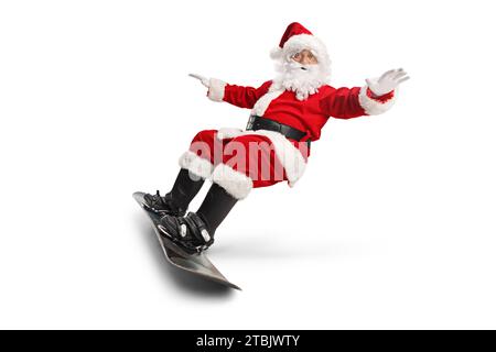 Santa claus riding a snowboard isolated on white background Stock Photo