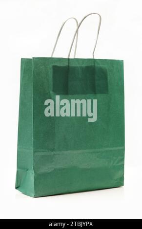 Green paper shopping bag isolated on white background Stock Photo